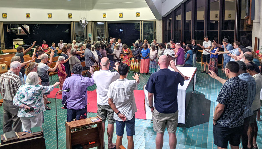 Members of the 2021 Diocese of the NT Synod praying for WALK a COVID-safe way to lay our hands on others in prayer ©Diocese of the NT