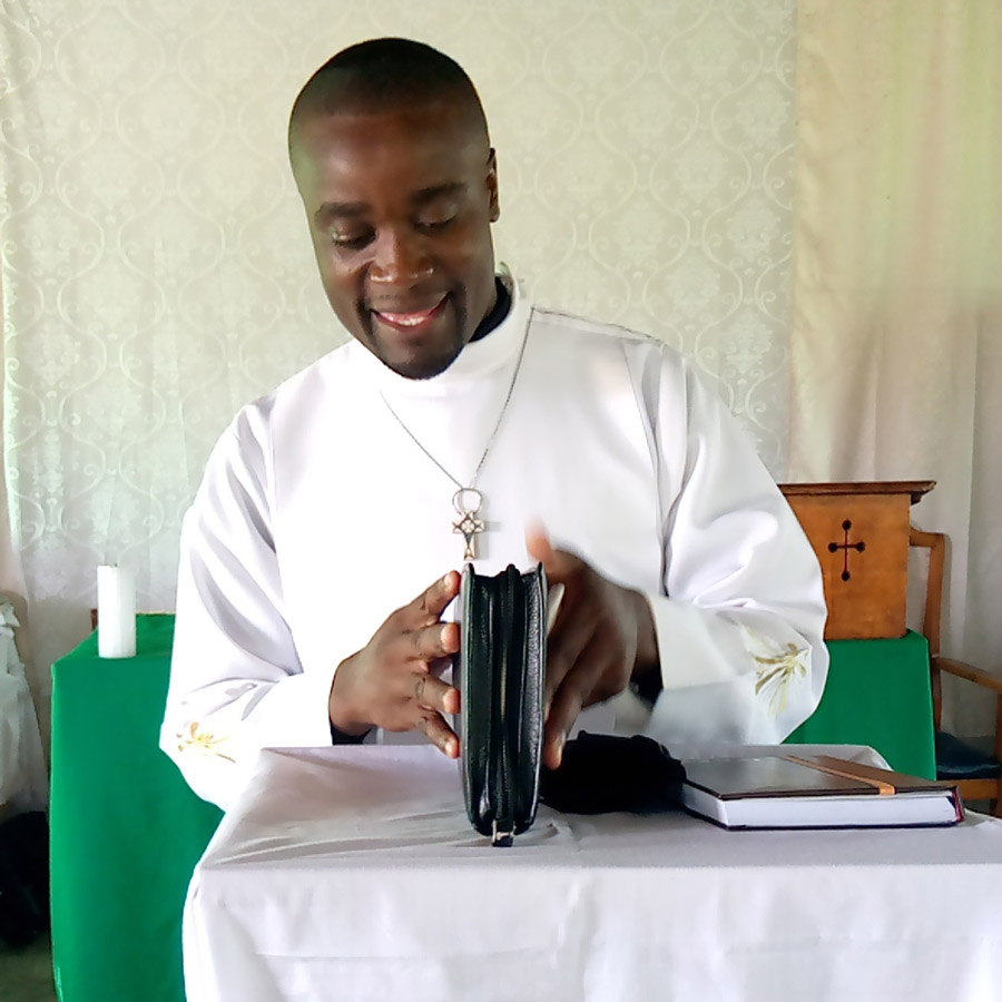 Adamson opens his bible before beginning to preach ©St John’s Seminary