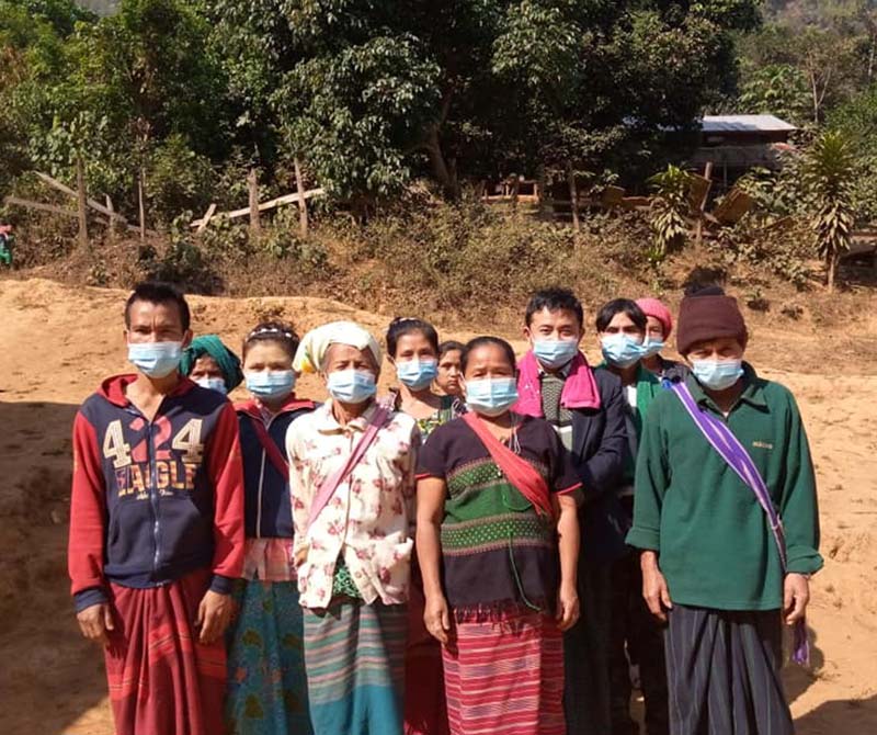 Villagers wearing newly delivered facemasks ©CPM