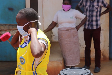 ABM’s partner in Kenya masks up to demonstrate COVID-safe hygiene practices. © Anglican Development Services.