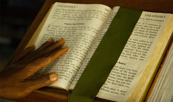 Hand on a bible ©Melany Markham/ABM