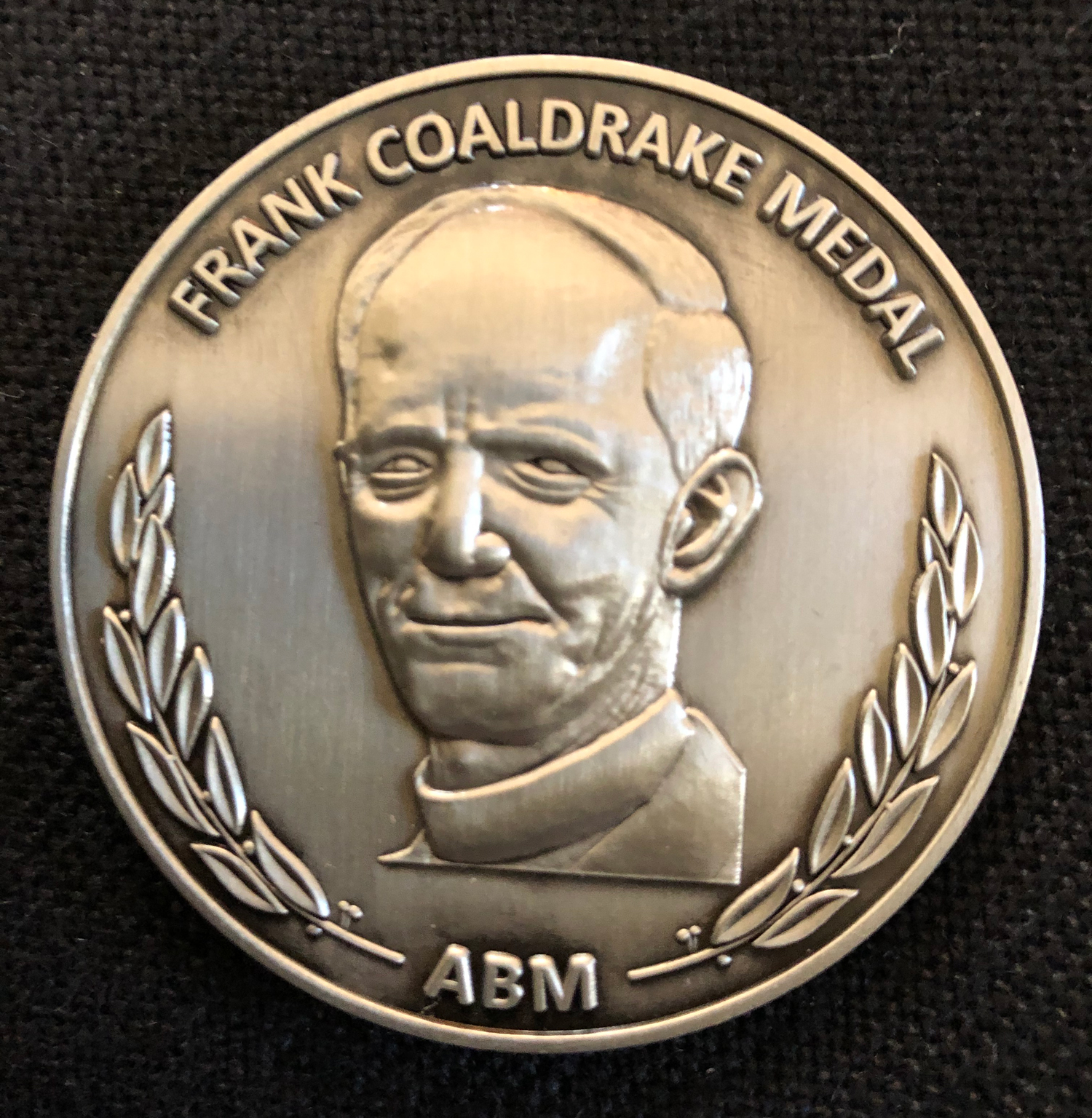 John received a Coaldrake medal for his exceptional service to God's mission
