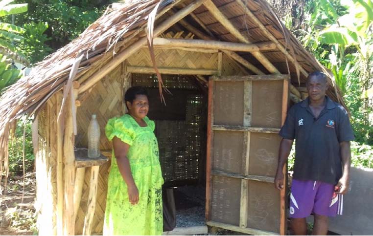 ACOM-V’s Rucinta Vora, with WASH volunteer Rainol Qenegle who helped build this toilet next to the Anglican Church in Mosina, Torba Province, Vanuatu. © ABM.