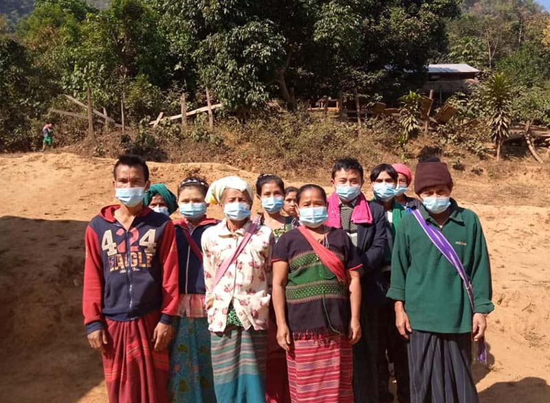 People in a remote village of Myanmar wearing their newly-delivered face masks © CPM