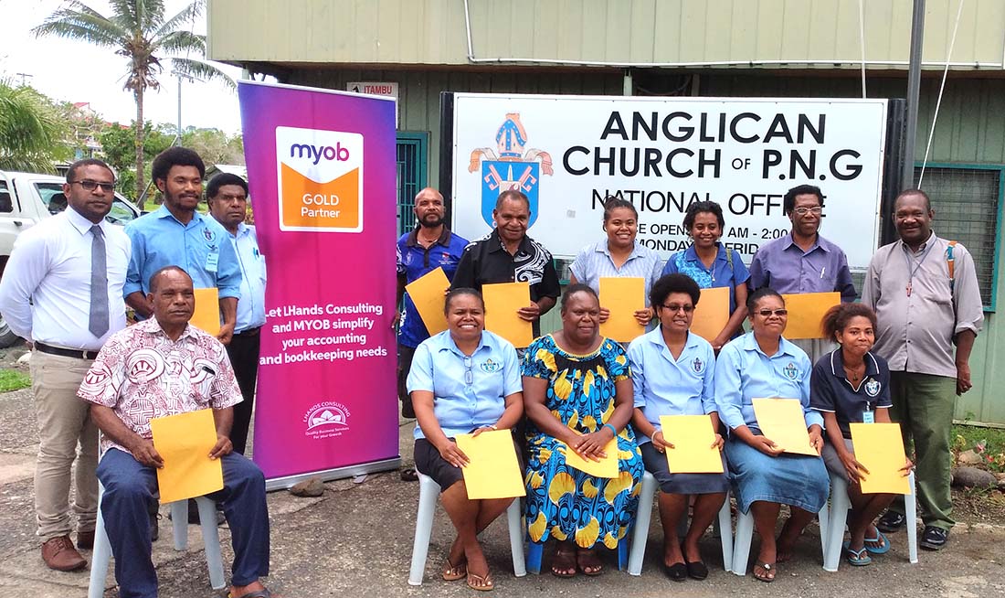 Anglican Church of Papua New Guinea staff show off their MYOB training certificates