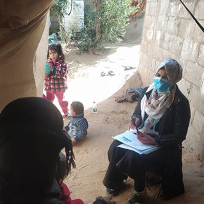 Aamira teaches a mother about child nutrition in Gaza. © Al Ahli Hospital, Gaza. Used with permission.