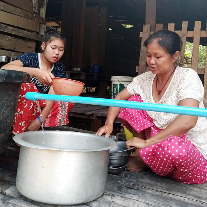 Daw ma Oo gets clean water piped to her house. © CPM. Used with permission.