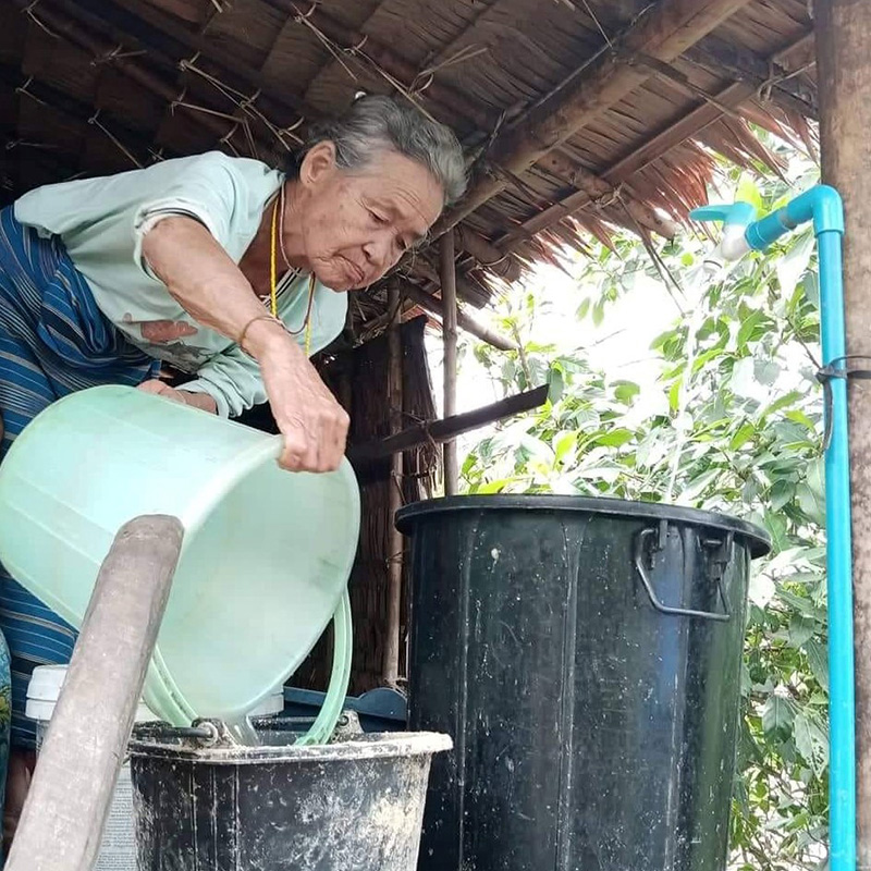 Naw Paw Htoo no longer has to cart water over long distances. © CPM. Used with permission.