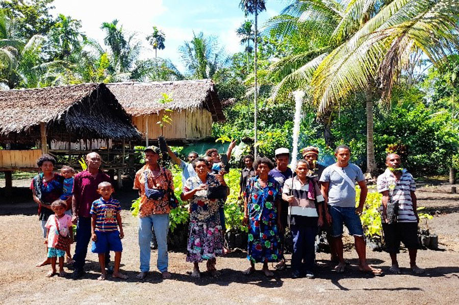 Some of the community members and their chief (middle) ©Anglicare PNG