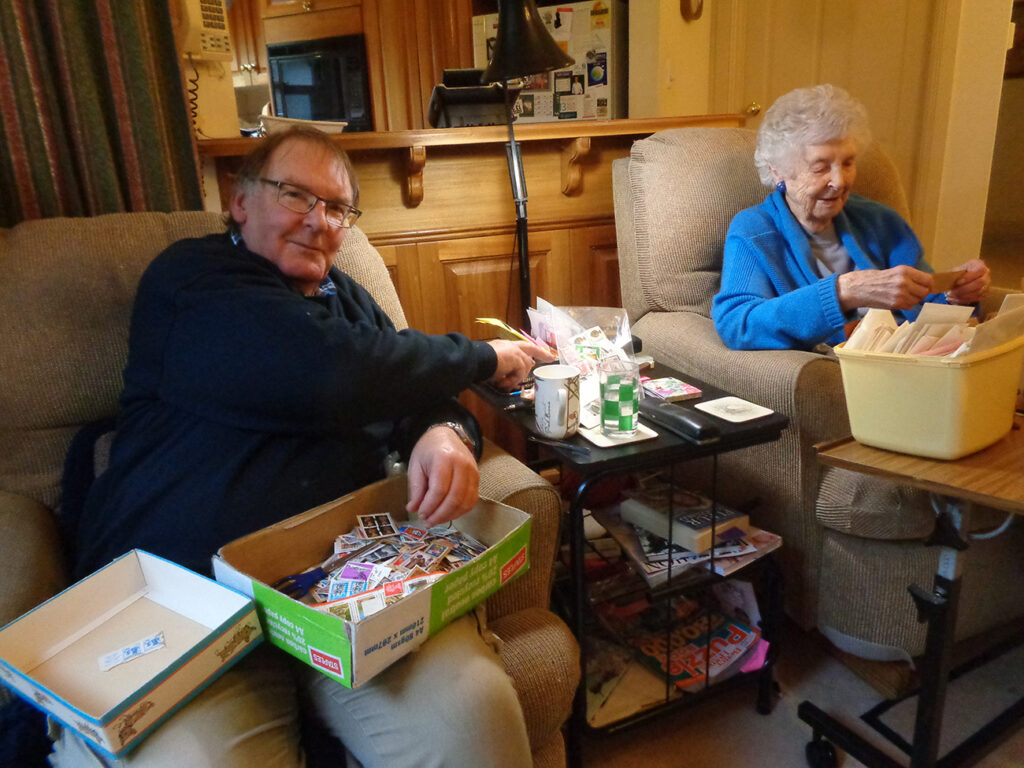 Pauline and Tim sorting stamps for ABM in Adelaide.