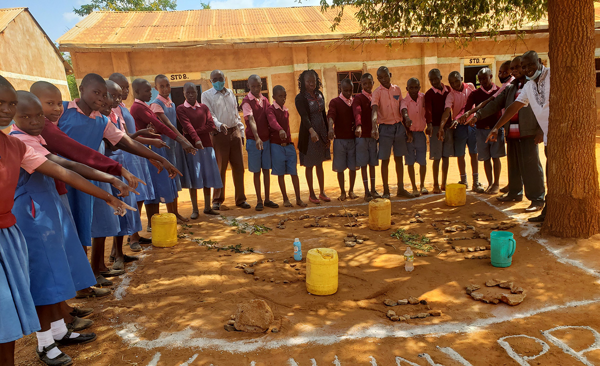 These school children demonstrate how the project has helped them with greater water access, hygiene and tree planting. © ADSE. Used with permission.