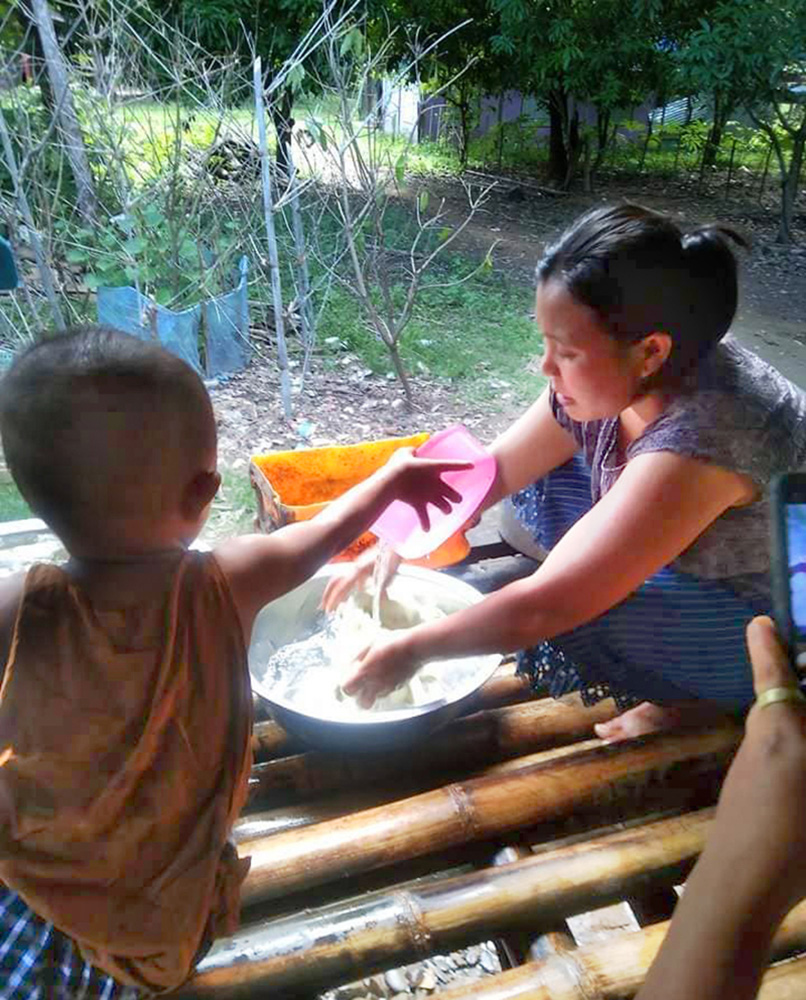 This Myanmar family now has ready access to clean water for cooking and washing. © CPM. Used with permission.