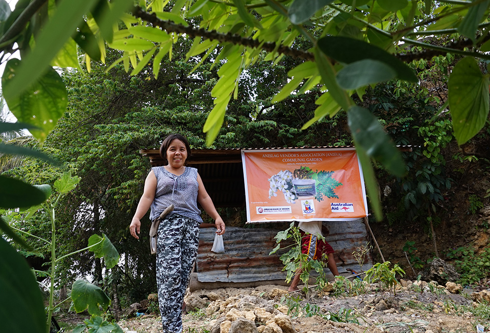 ANISVA’s elected chair, Yoland Balud, in the group’s herbal garden. © IFI-VIMROD. Used with permission.