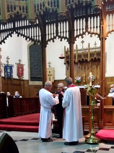 Mary Catford receives her award from the Rev’d Dr John Deane in Adelaide.