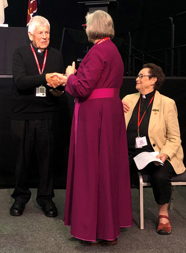 Rev’d Jack Thompson receives his award from Archbishop of Perth, the Most Rev’d Kay Goldworthy as the Venerable Angela Webb looks on.