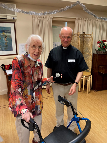 Joan Durdin receives an award from Rev’d Paul Devonport on behalf of her late twin sister, Sr Patience, in Adelaide.