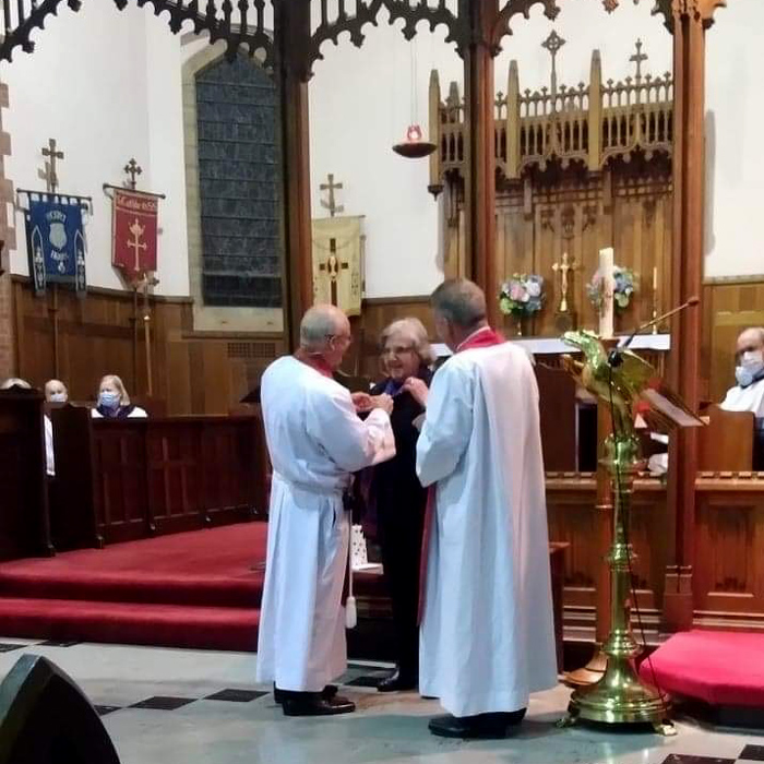 Mary Catford receives her award from the Rev’d Dr John Deane in Adelaide.