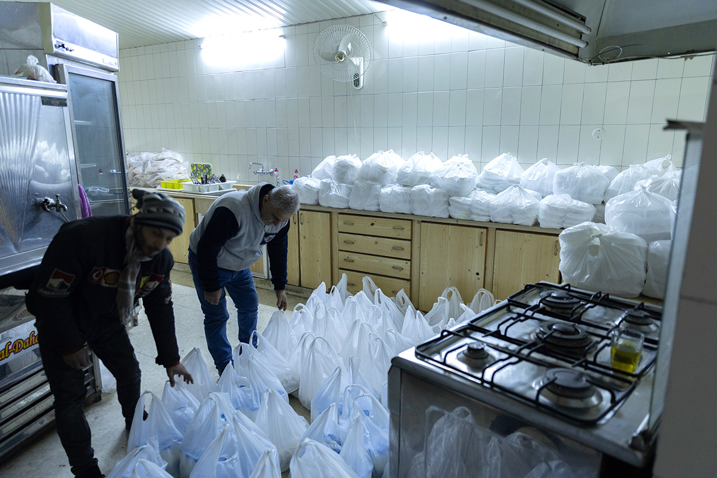 Volunteers from the Middle East Council of Churches pack and distribute emergency supplies to earthquake survivors in northern Syria.