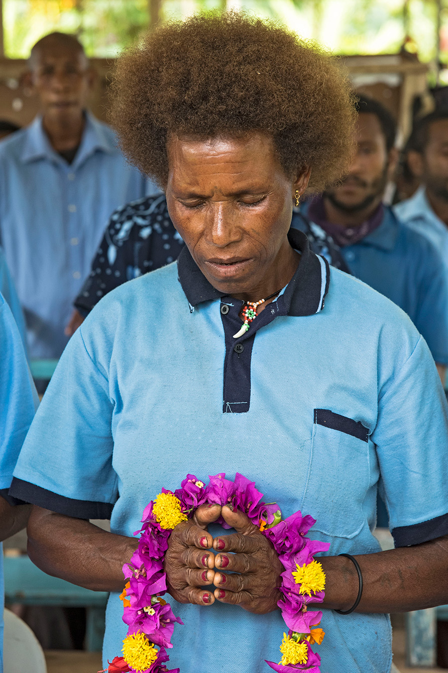 A literacy student prays before her class begins, Papua New Guinea. © Ivy Wang, ABM.