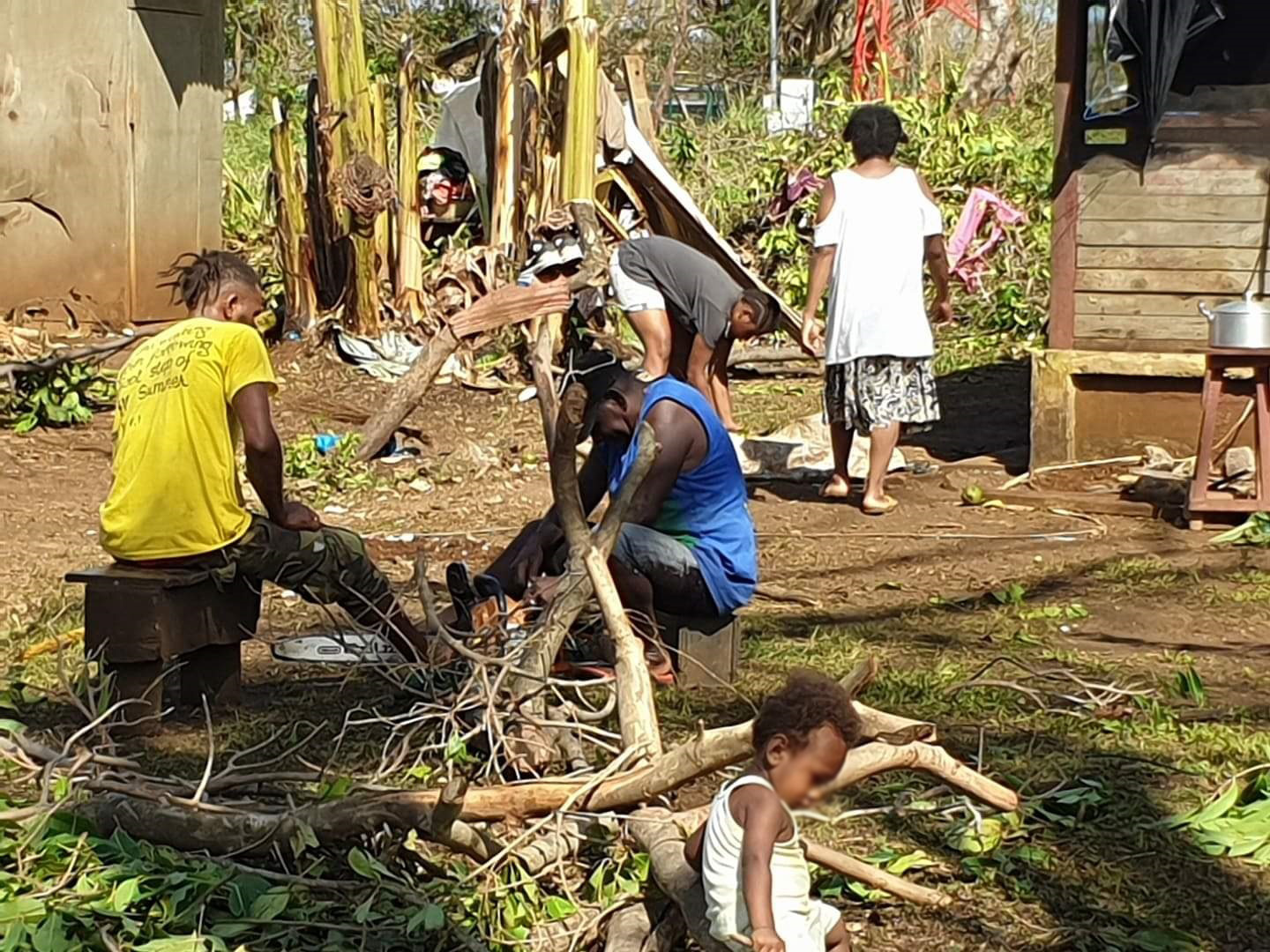 A clean up takes place following cyclone damage. © ACOM-Vanuatu. Used with permission.