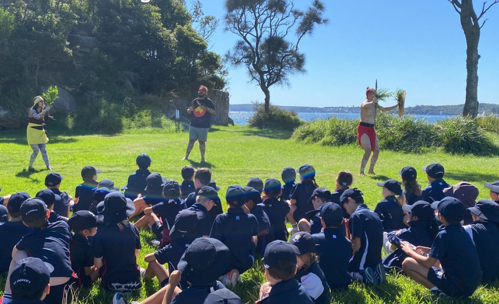 St Andrews children participate in a cultural experience on Sydney Harbour. © Gawura School. Used with permission.