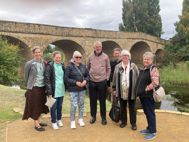 The Anglican tour group pictured with ABM’s Meagan Schwarz (left) and Rev’d Warwick Cuthbertson from the Tasmania ABM Committee (centre) in front of the historic Richmond Bridge ©ABM