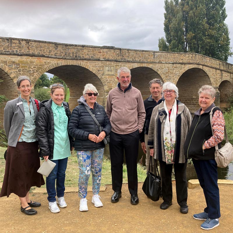 The Anglican tour group pictured with ABM’s Meagan Schwarz (left) and Rev’d Warwick Cuthbertson from the Tasmania ABM Committee (centre) in front of the historic Richmond Bridge ©ABM