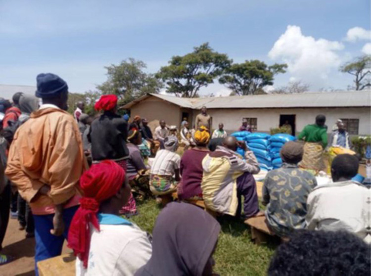 People waiting for food relief funded by ABM AID. © Anglican Province of Congo. Used with permission.