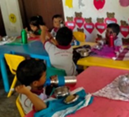 School children with the food they received as part of the response. © Diocese of Colombo. Used with permission.