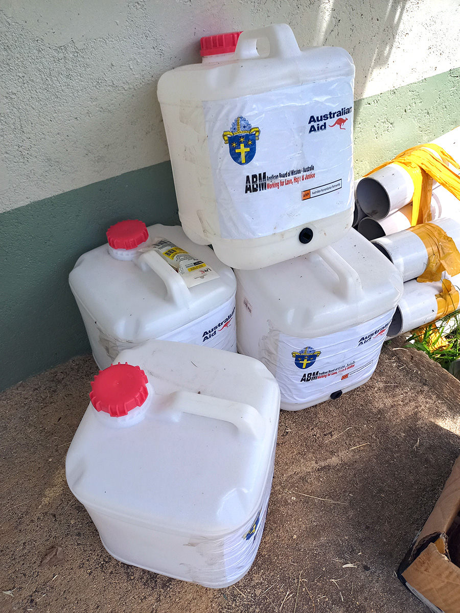 Water containers and piping await distribution during ACOM’s COVID-19 Response. © ACOM Vanuatu. Used with permission.