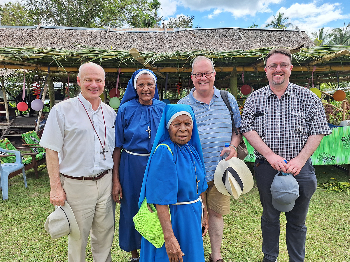 Paul, the Rev’d Andrew Sempell and Robert McLean with the Sisters of the Visitation © Paul Devenport, ABM.