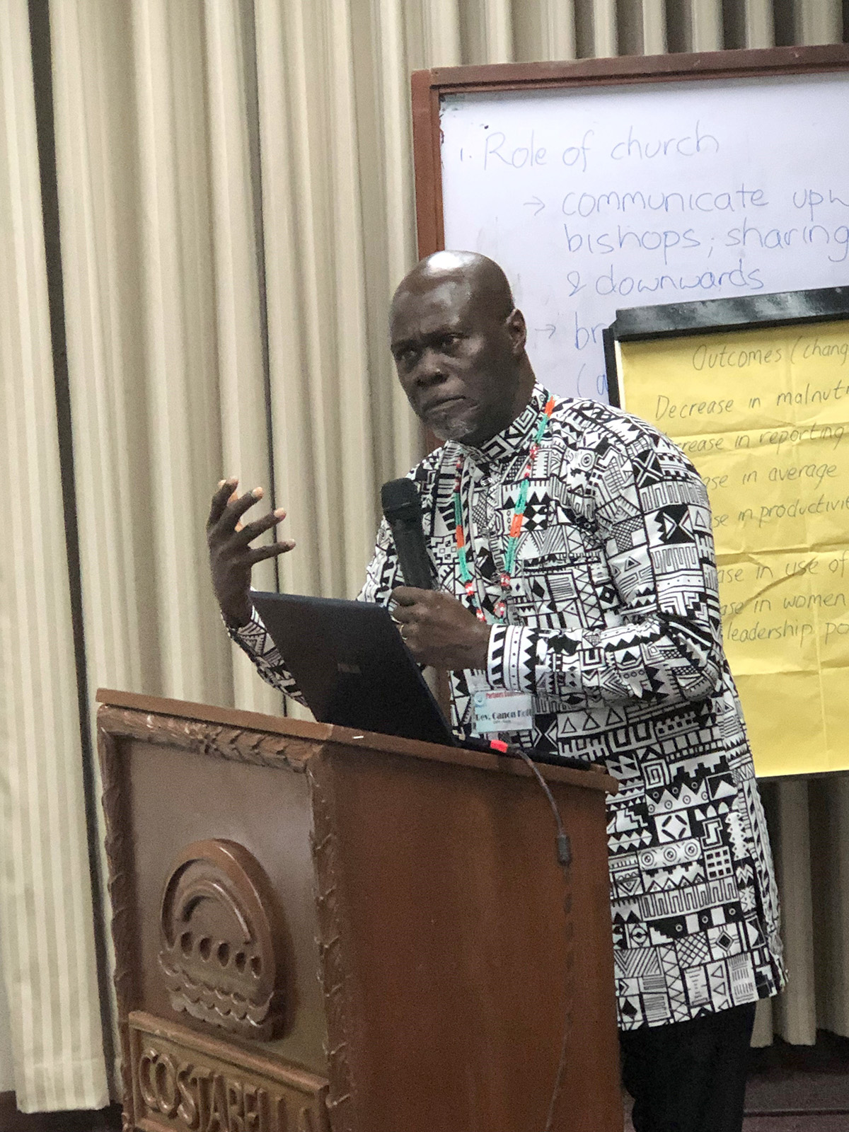 The Rev’d Canon Kofi deGraft-Johnson makes a presentation at AID’s Partner Conference in June 2023 © Julianne Stewart, AID.