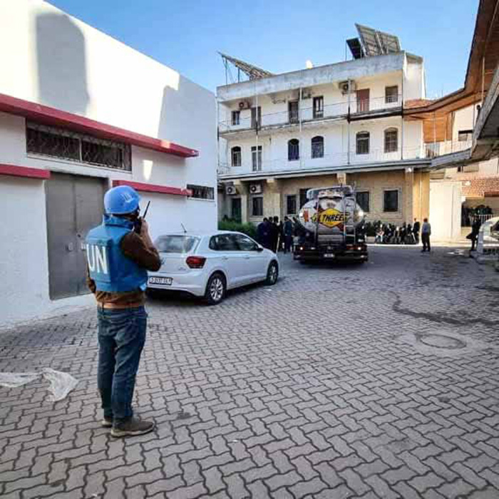 A UN aid worker oversees delivery of fuel to Al-Ahli hospital early in the ceasefire. © Diocese of Jerusalem. Used with permission.