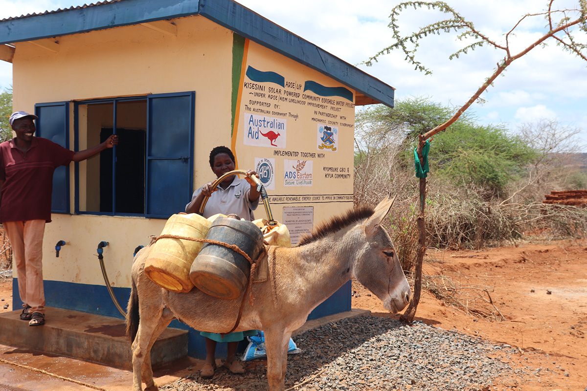 Mbulo fetches water from Kisesini community borehole. Improved water access has improved livelihoods in Eastern Kenya. © ADSE. Used with permission.