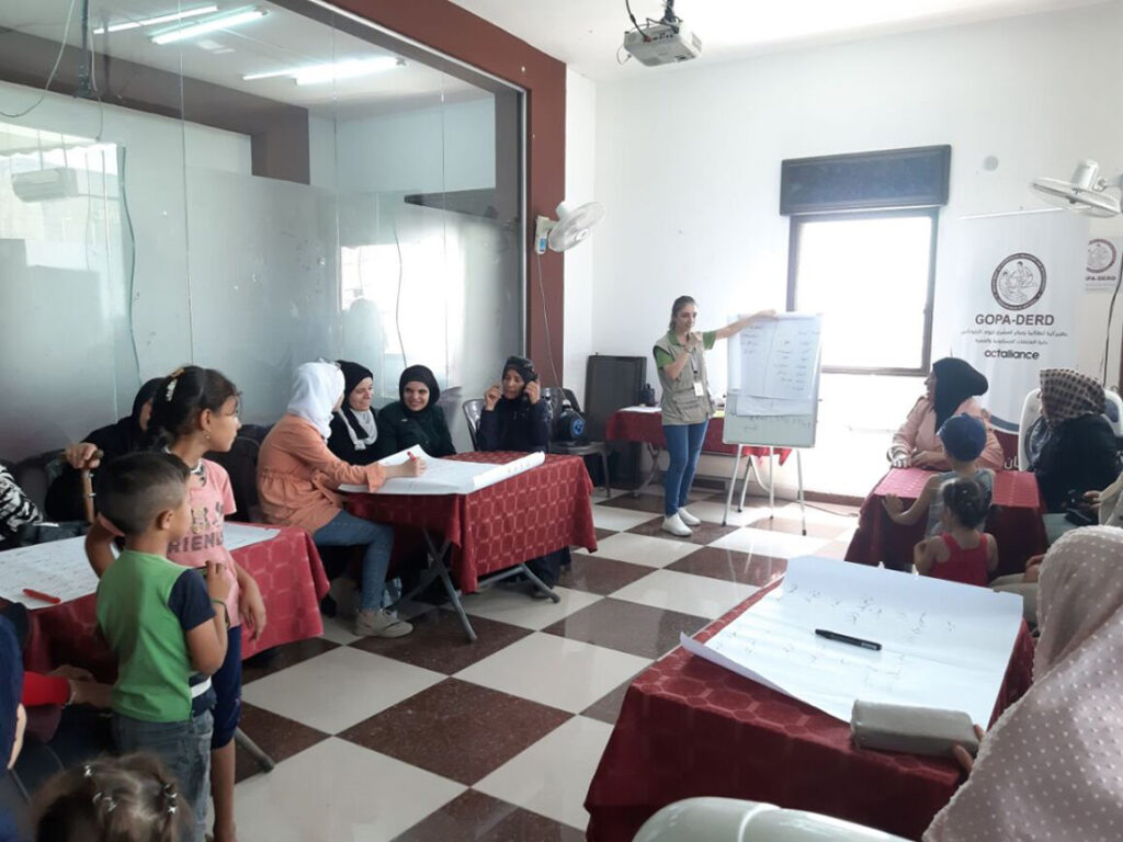 1. Women attending awareness sessions on self-care and coping strategies after the earthquake in Northern Syria. © GOPA-DERD. Used with permission.
