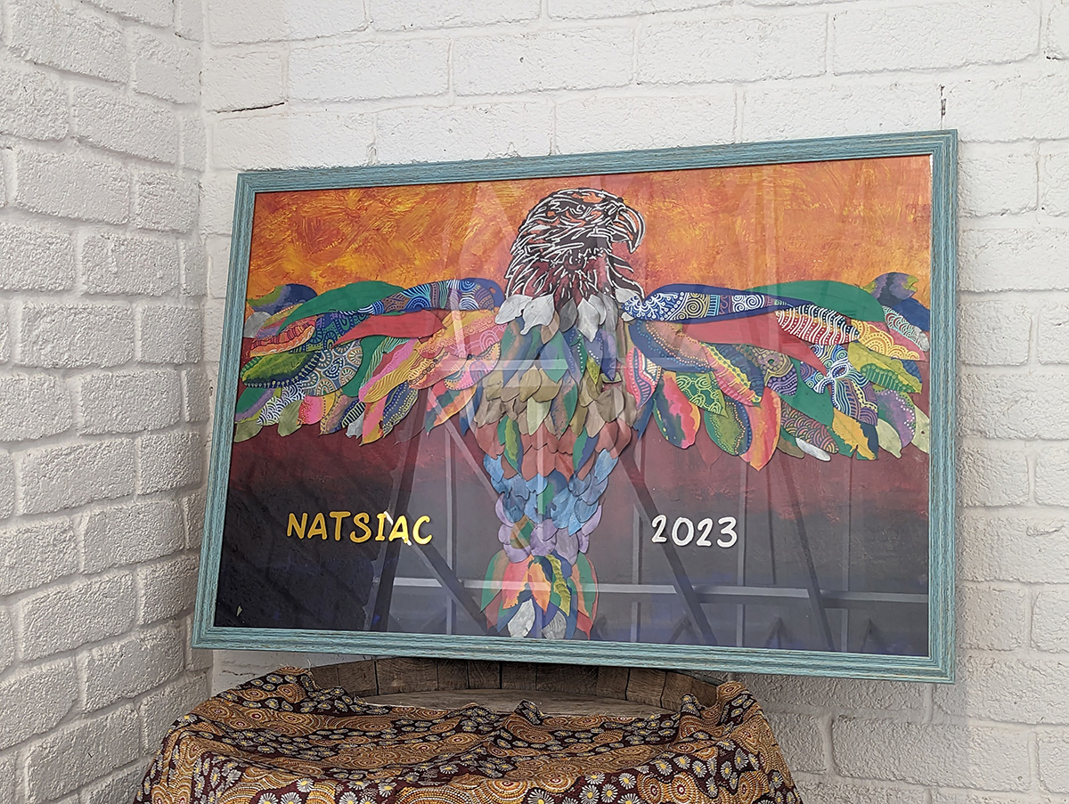 Photo of artwork painted by Auntie Di’s daughter Belinda Roberts specifically for NATSIAC gathering 2023. © Belinda Roberts, 2023. Used with permission.