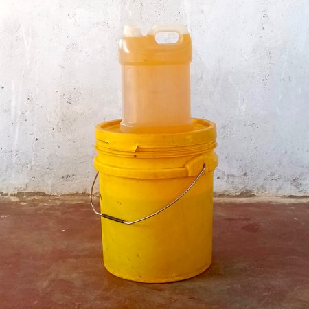 Containers of sunflower oil produced from the farming partnership between the Kalwani Gender Action Group and the Men Engage Network © ZACOP. Used with permission.
