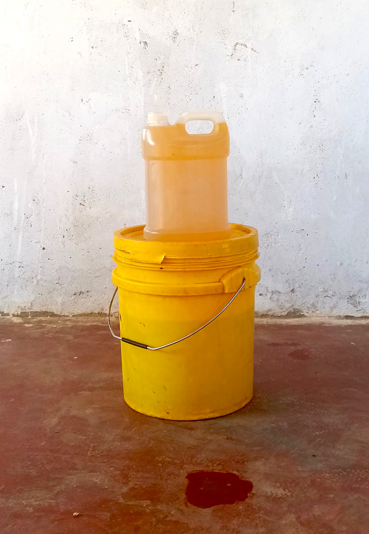 Containers of sunflower oil produced from the farming partnership between the Kalwani Gender Action Group and the Men Engage Network © ZACOP. Used with permission.