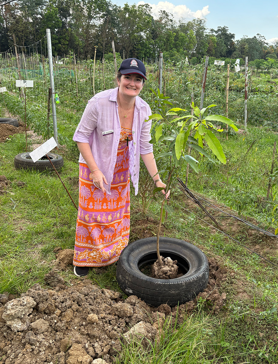 Juliana planted a mango tree at ISAP farm, part of a future orchard © ABM/Meagan Schwarz