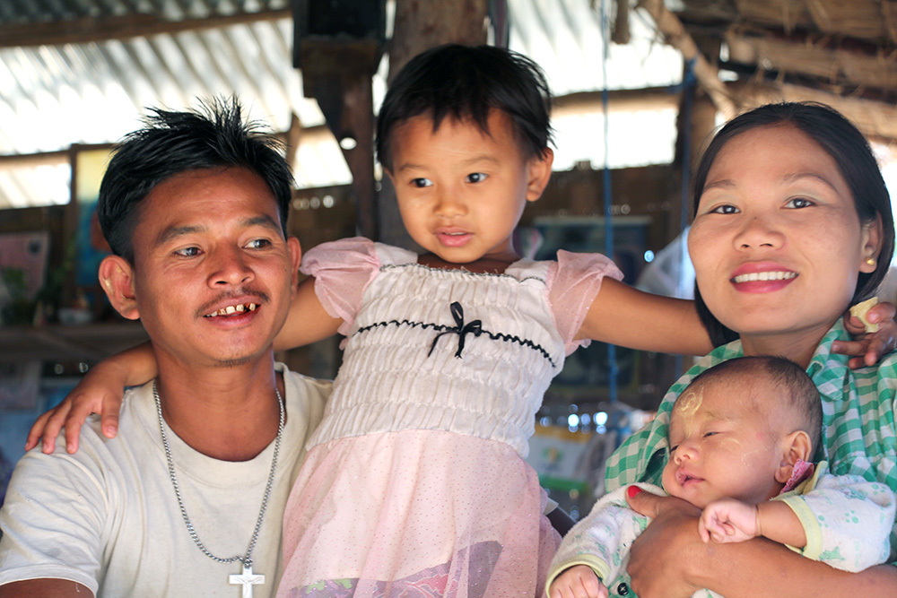 Win with his wife, Naing, and their two children in 2015.