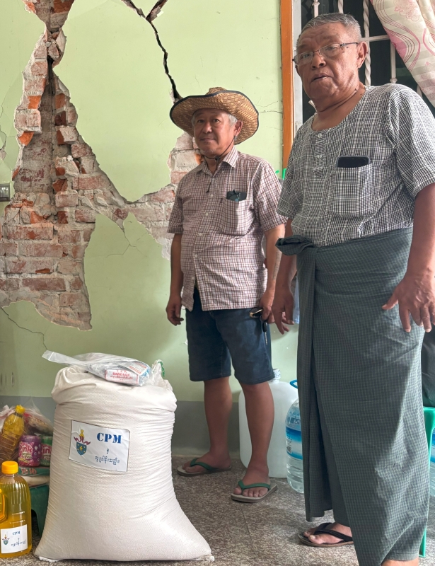 In Mandalay, Archdeacon Joseph Yin Oo (left) and church volunteer Naw Aung prepare relief packages for distribution. © CPM. Used with permission.