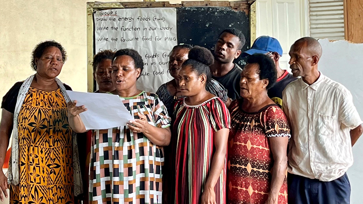 Jennifer (front) and fellow students at Port Moresby Adult Literacy School give a group presentation. Nov 2024, PNG. © ABM AID/Kate Winney