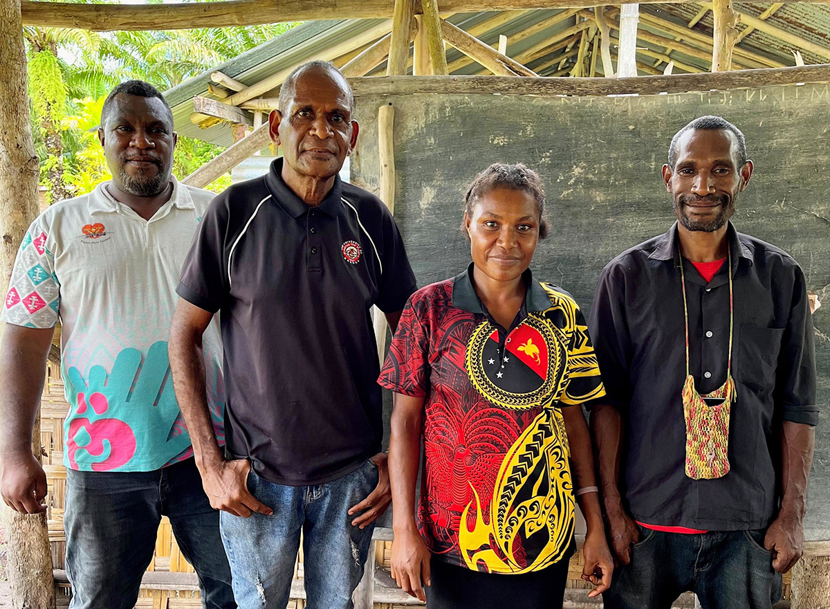 Sorovi, Popondetta: Michael Ambo (far left) with adult literacy teachers. Michael coordinates the church’s literacy program in PNG. © Kate Winney/ABM AID.