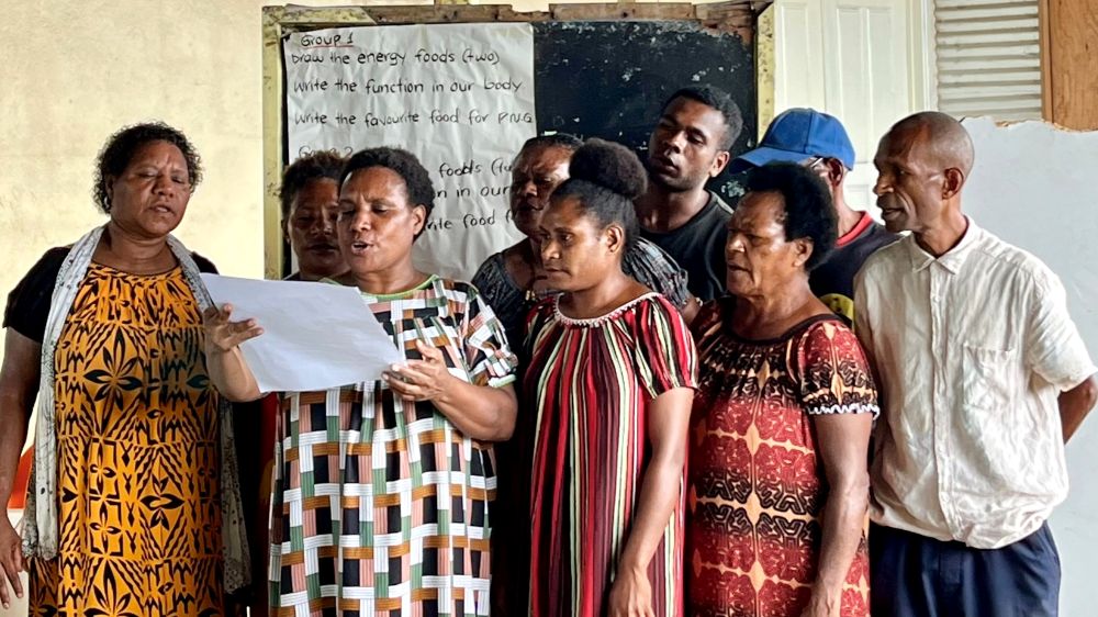 Students at Port Moresby Adult Literacy School giving a group presentation. Nov 2024, PNG. © ABM AID/Kate Winney