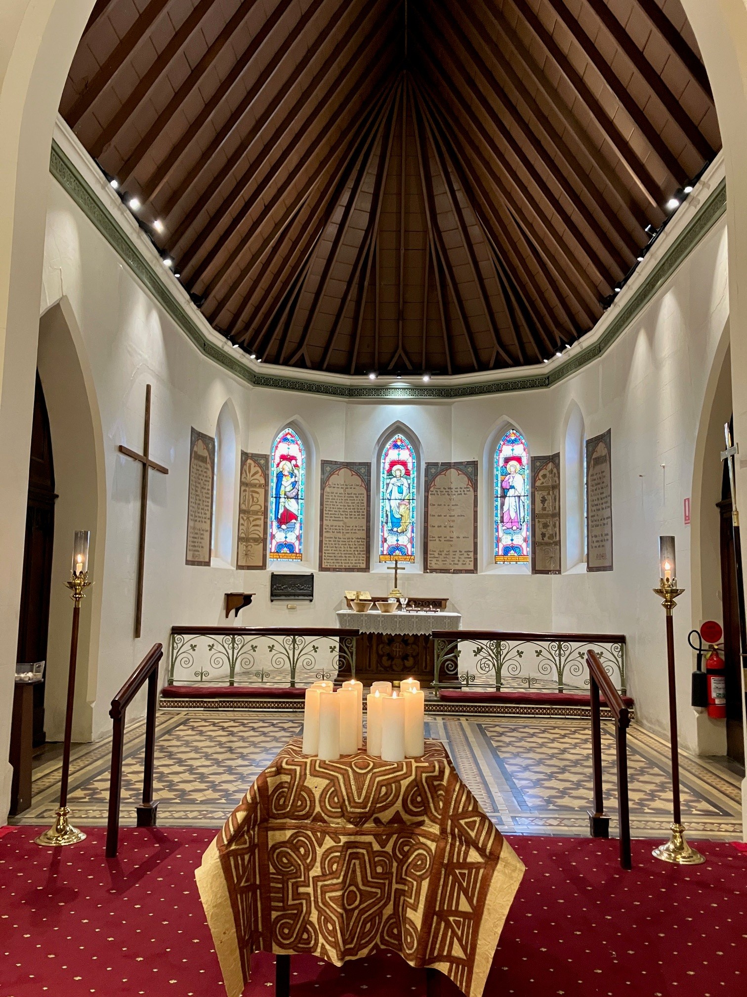 At St Luke’s Concord, twelve candles were lit, representing the 12 New Guinea Martyrs. The table is covered in Tapa cloth, a traditional decorated bark cloth made in the area where the Martyrs were killed. © Moya Holle, used with permission.