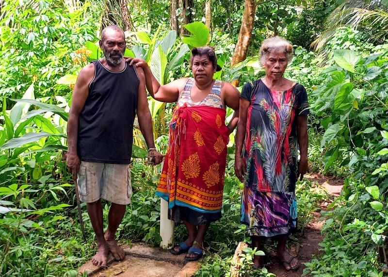 Aknis, Malory and Evithy are delighted to be able to collect clean water more easily from this new standpipe. Fanafo Village, Santo Island, Vanuatu © ACOM Vanuatu. Used with permission.