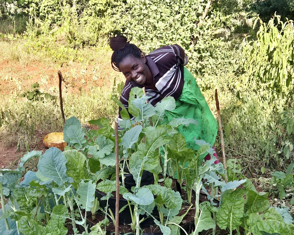 Annah tends her conical garden, which she learnt how to make through our local partner in Kenya © ADSE. Used with permission.