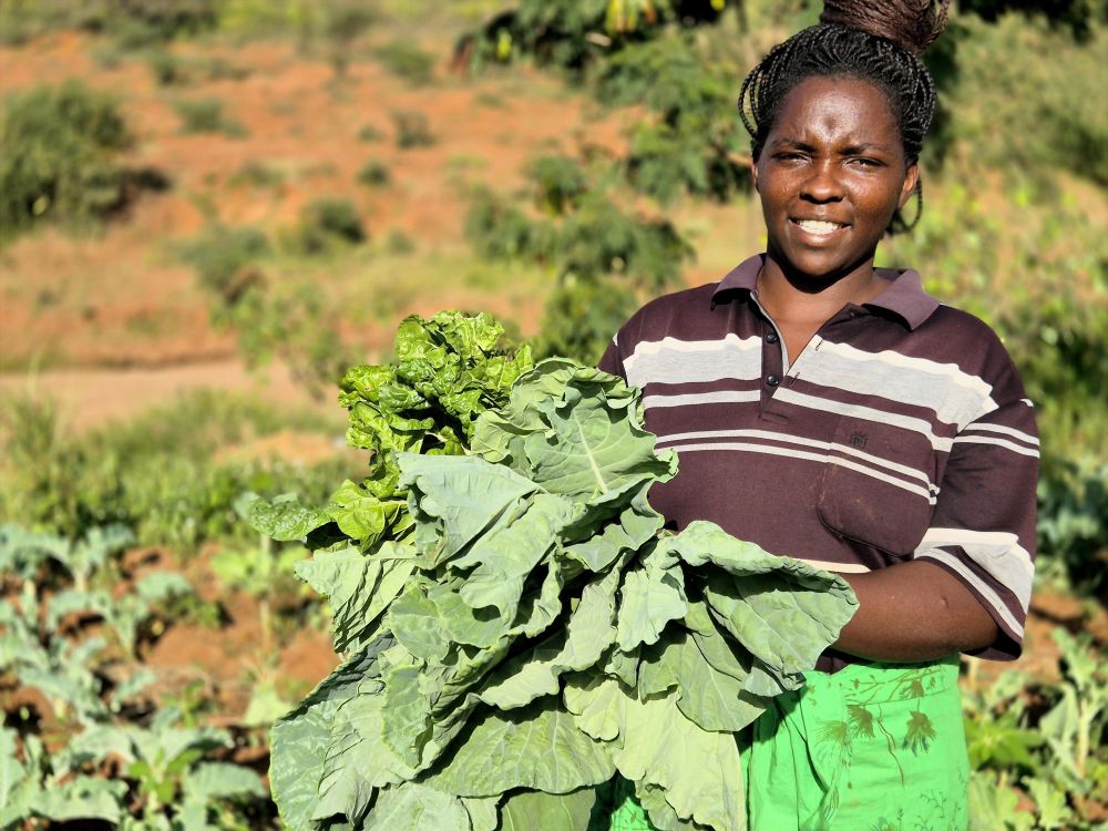 Annah, a mother of four and a small scale vegetable farmer from rural Kenya © ADSE. Used with permission.
