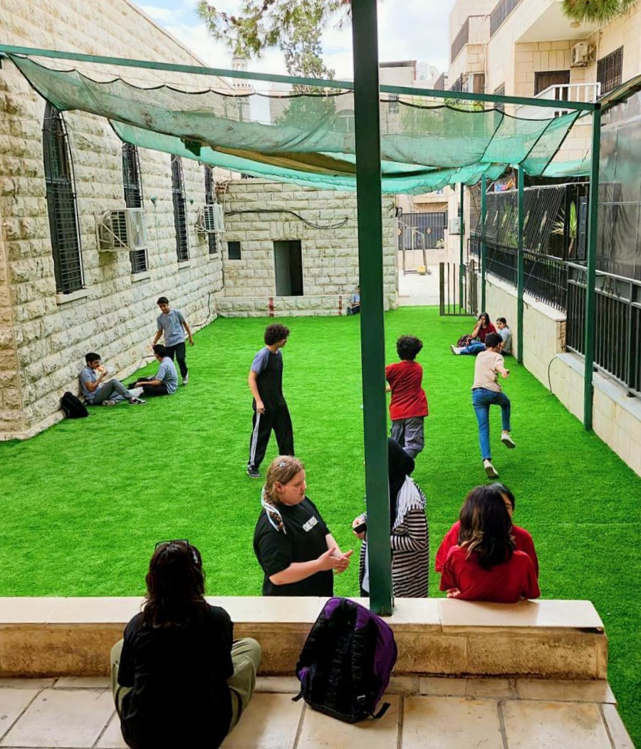 Children playing in the newly renovated outdoor courtyard © HLID. Used with permission.
