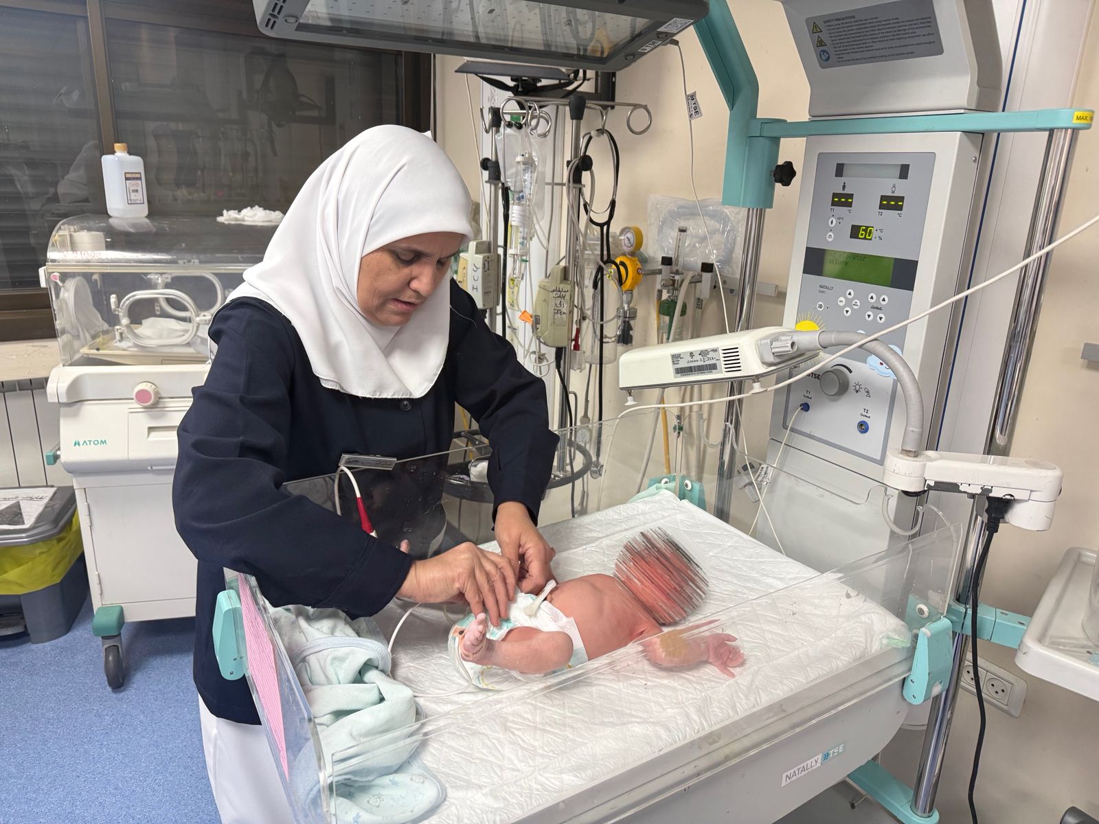 A midwife tends to a newborn baby at St Luke's Hospital in the West Bank © Diocese of Jerusalem